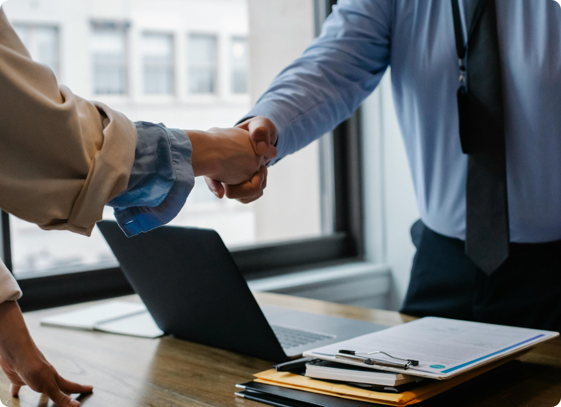 Professional handshake representing successful arbitration and mediation services